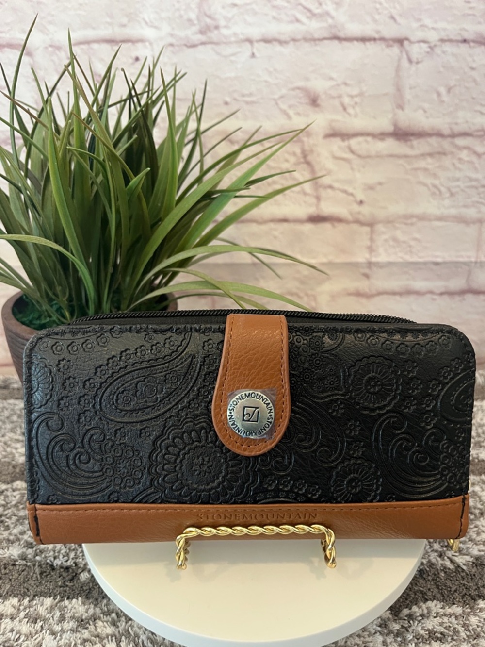 Stone Mountain Black and Brown Zip-Around Embossed Leather Wallet